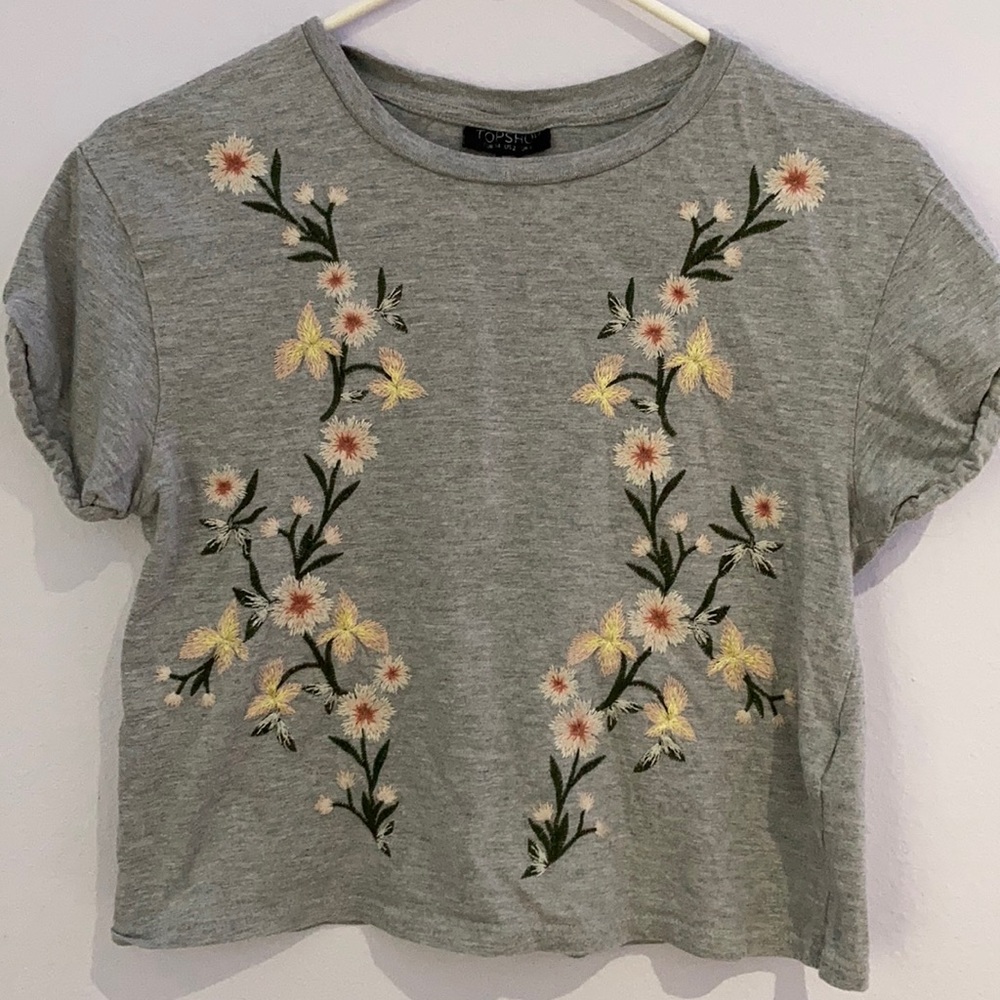 gray crop top with embroidered flowers
